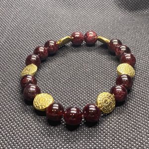 Garnet with gold finished pewter mandala beads Bracelet